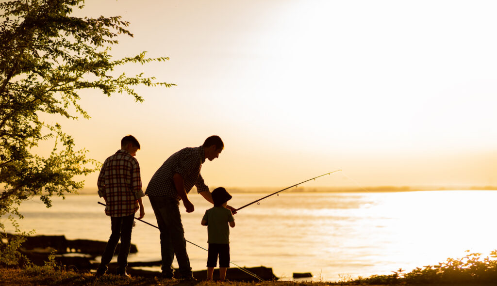 dad and two sons fishing